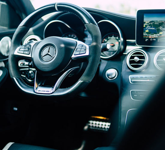 Interior steering wheel shot of Mercedes Benz prestige car which can be protected with the help of Insure 313 insurance brokers.