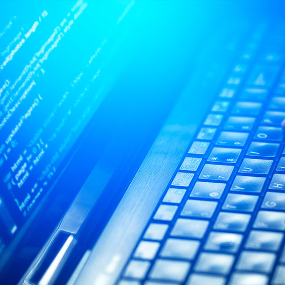 A laptop showing cyber threats whose outcome can be insured with cyber insurance arranged by Insure 313.