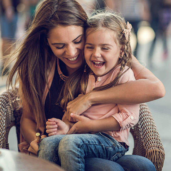 A young mother and her daughter find protection through life insurance arranged by Insure 313 insurance brokers.